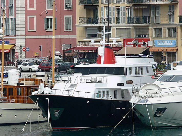 a couple of boats sit in a harbor aboard SOUNION II Yacht for Sale