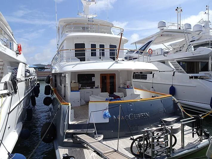 a boat docked at a pier aboard MACGUFFIN Yacht for Sale
