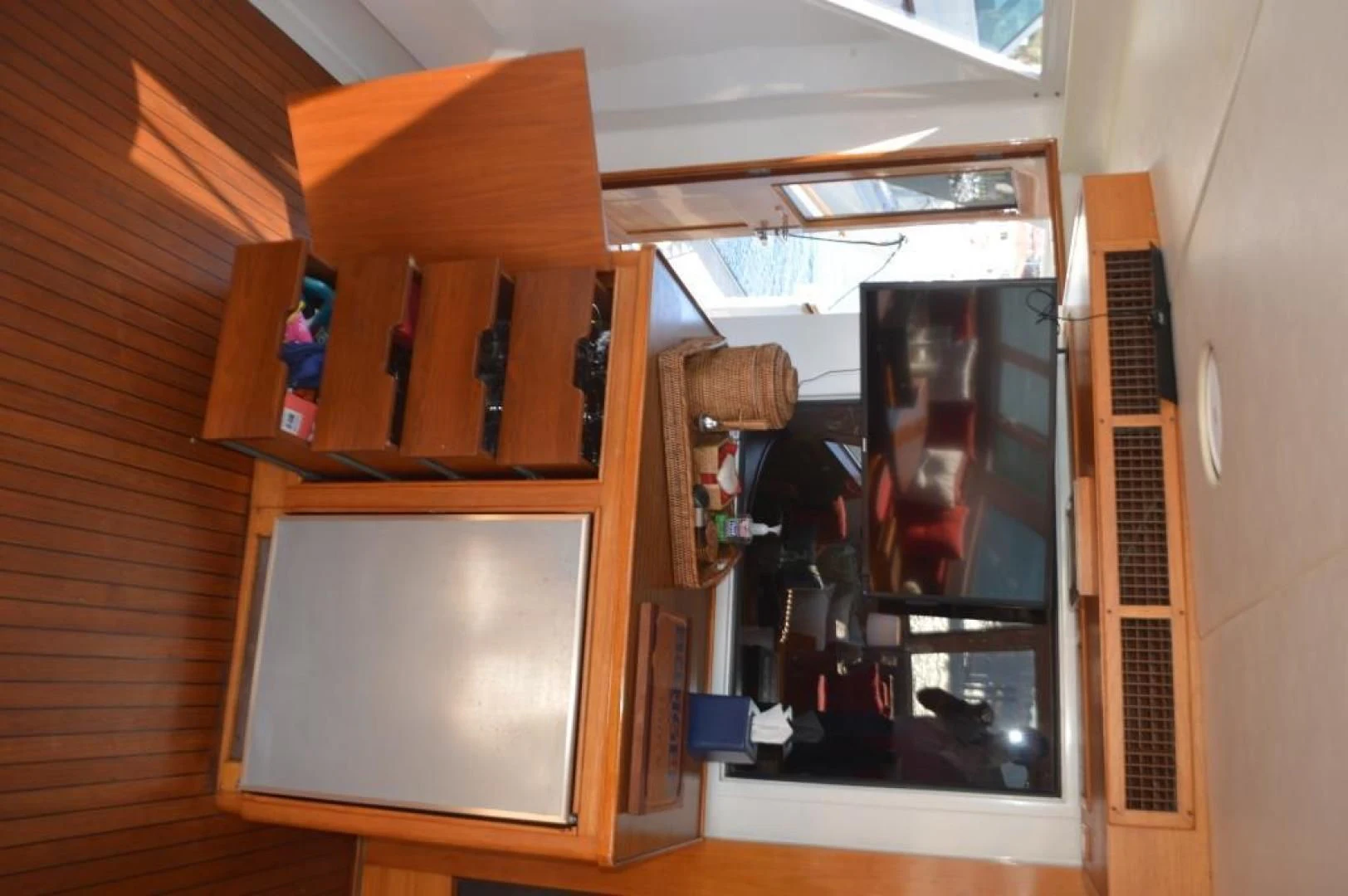 a room with a cabinet and shelves aboard ENCORE V Yacht for Sale