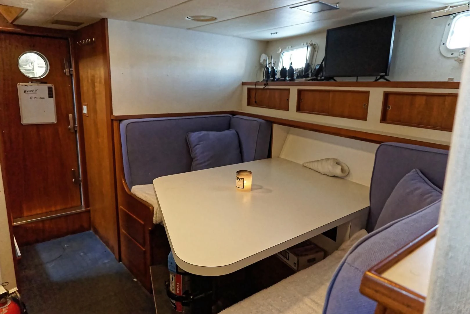 a room with a couch and a table aboard ENCORE V Yacht for Sale