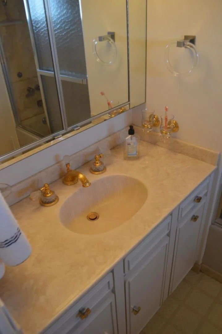 a bathroom with a sink and a mirror aboard ENCORE V Yacht for Sale