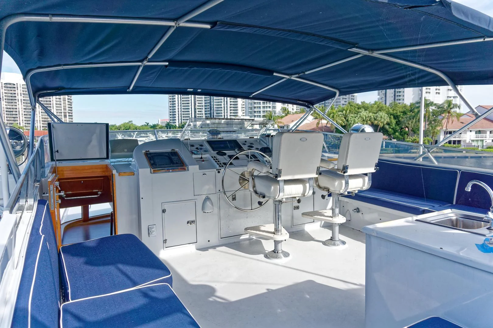 a boat with a deck and chairs aboard ENCORE V Yacht for Sale