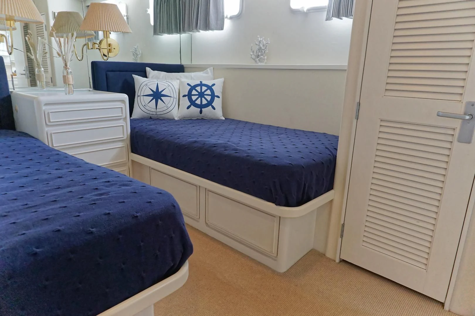 a couple of beds in a room aboard ENCORE V Yacht for Sale