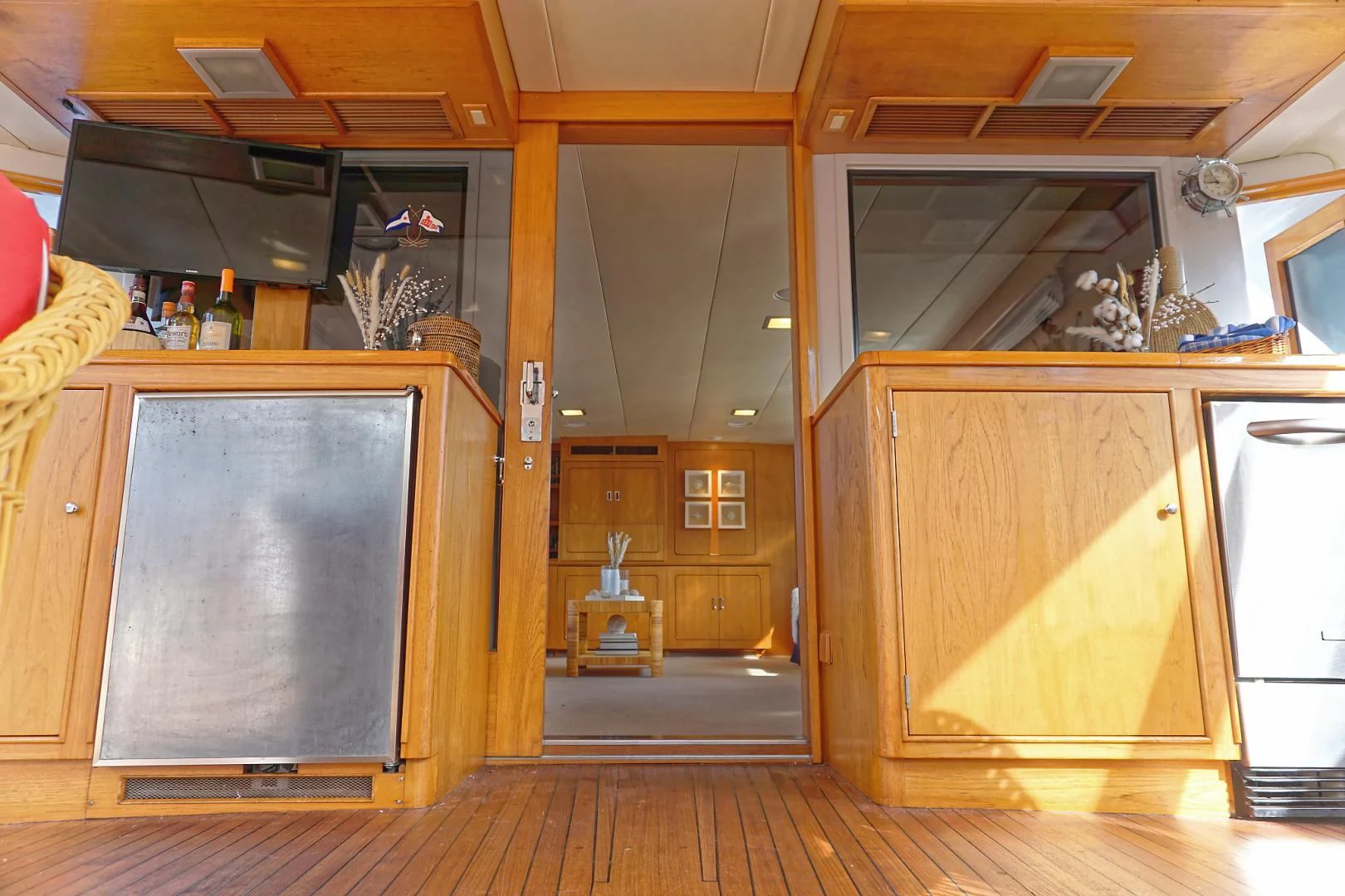 a kitchen with wooden cabinets aboard ENCORE V Yacht for Sale