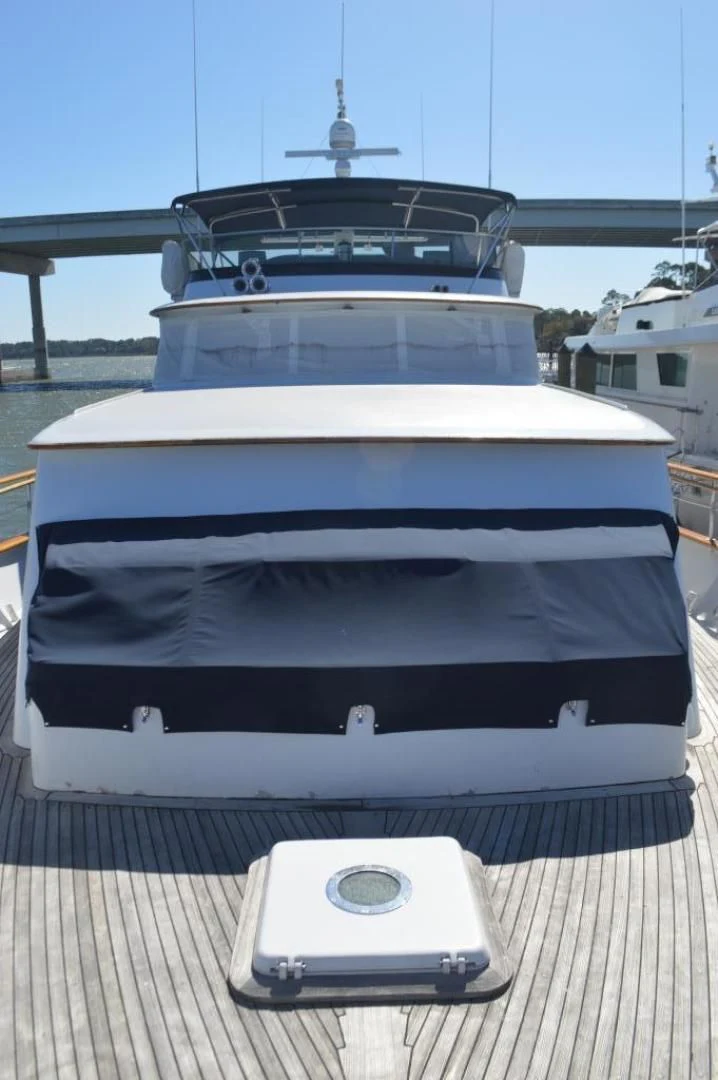 a white phone on a deck aboard ENCORE V Yacht for Sale