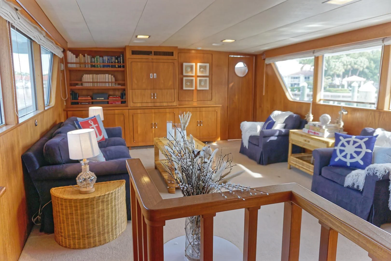 a living room with a table and chairs aboard ENCORE V Yacht for Sale