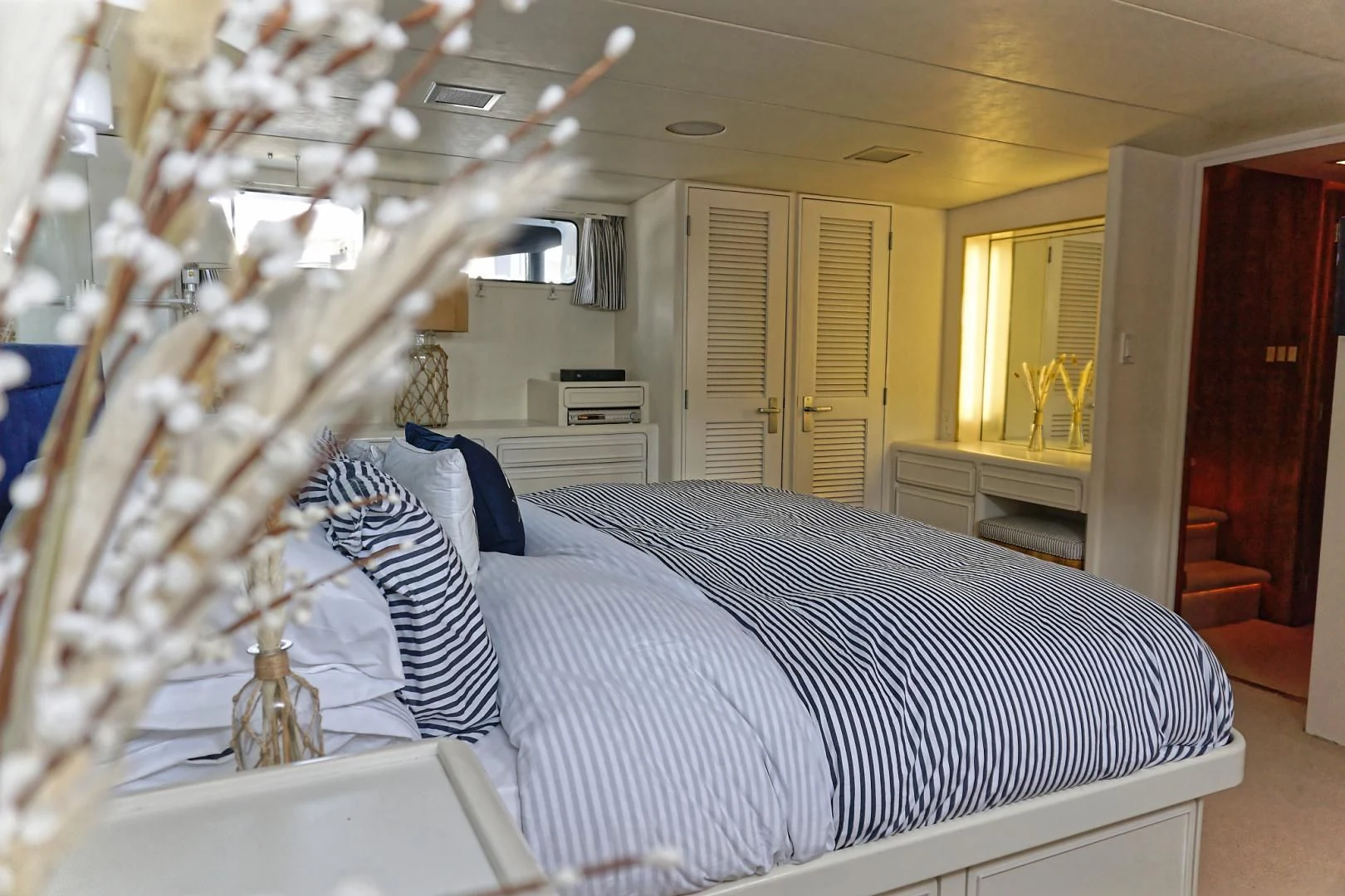 a bedroom with a large bed aboard ENCORE V Yacht for Sale