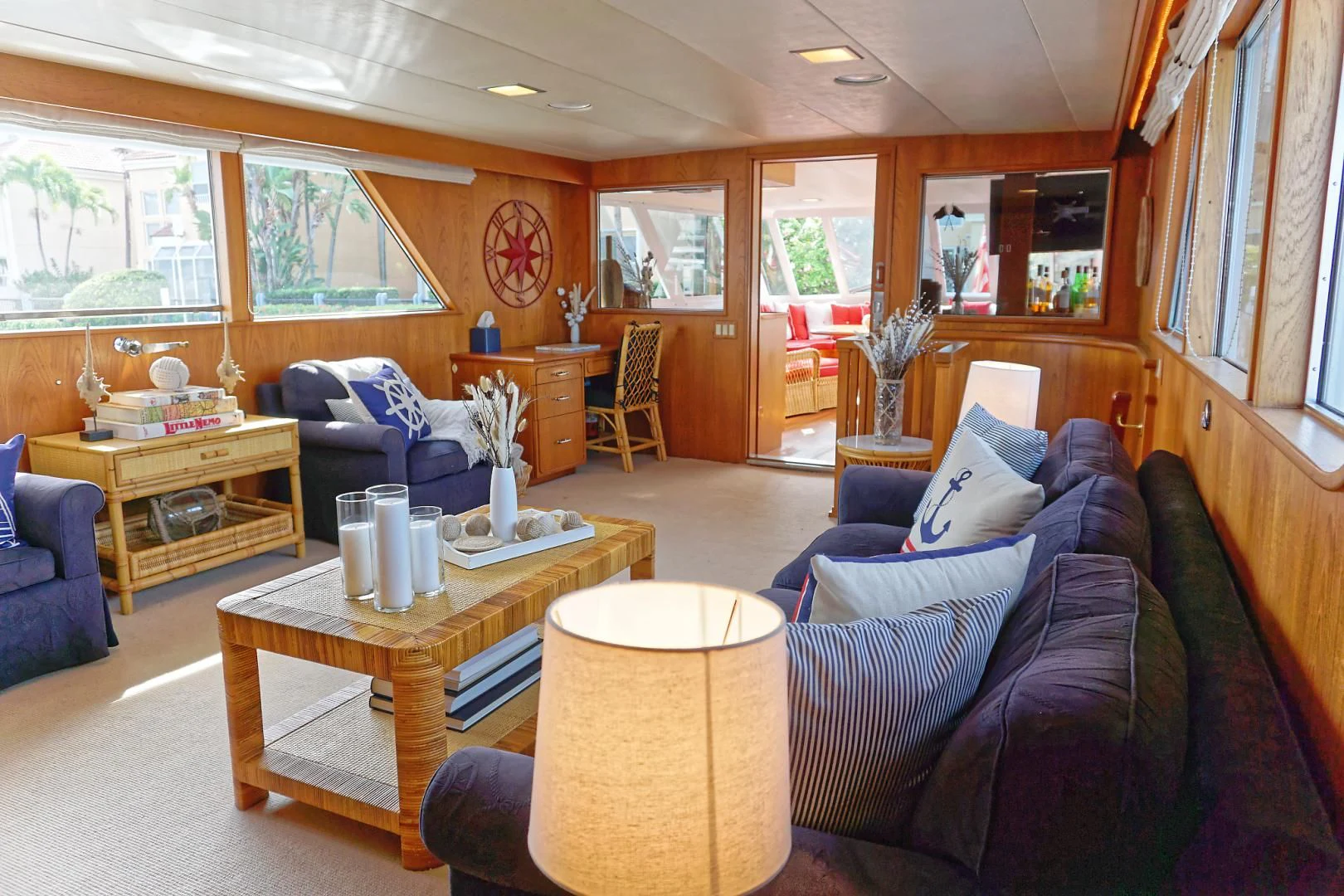 a living room with a table and chairs aboard ENCORE V Yacht for Sale