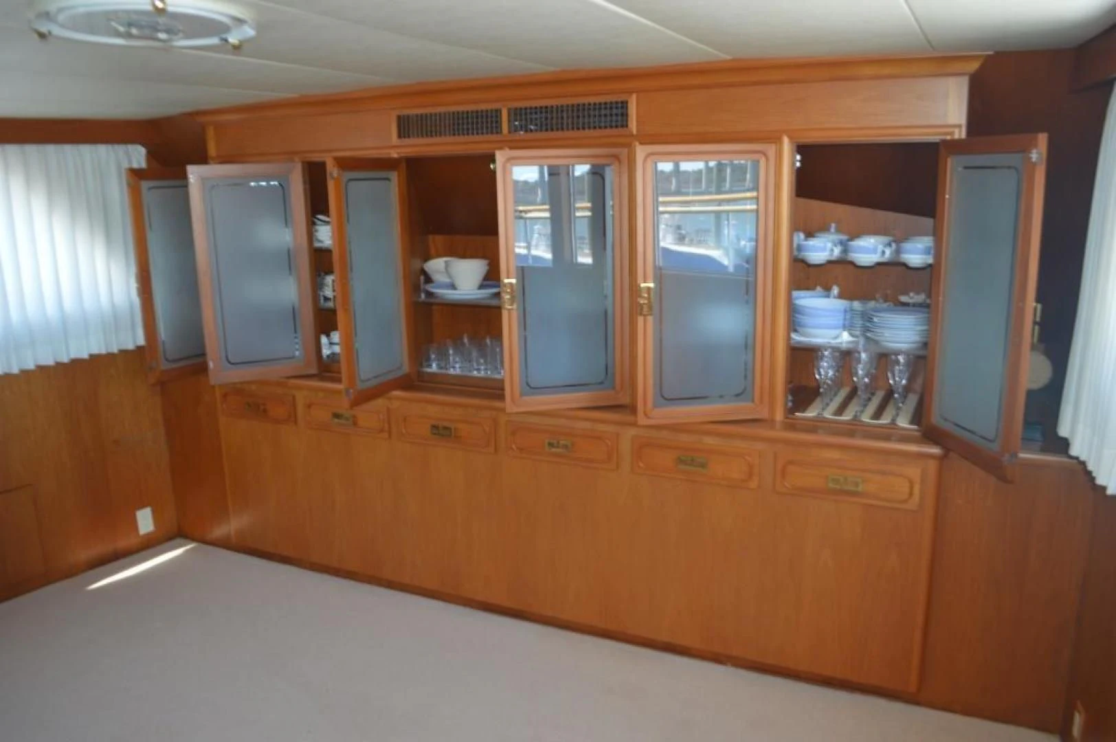 a kitchen with wooden cabinets aboard ENCORE V Yacht for Sale