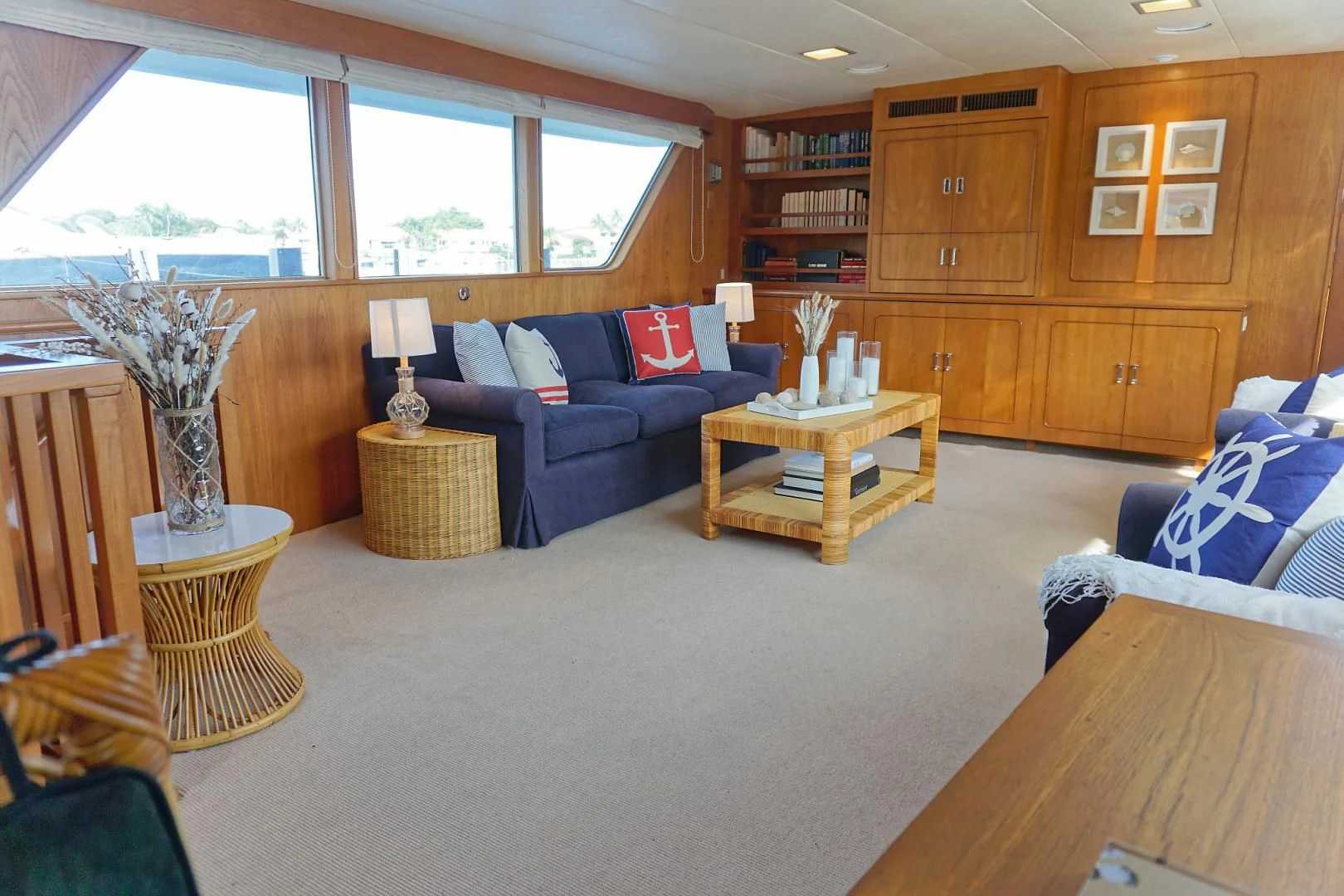 a living room with a couch and a coffee table aboard ENCORE V Yacht for Sale