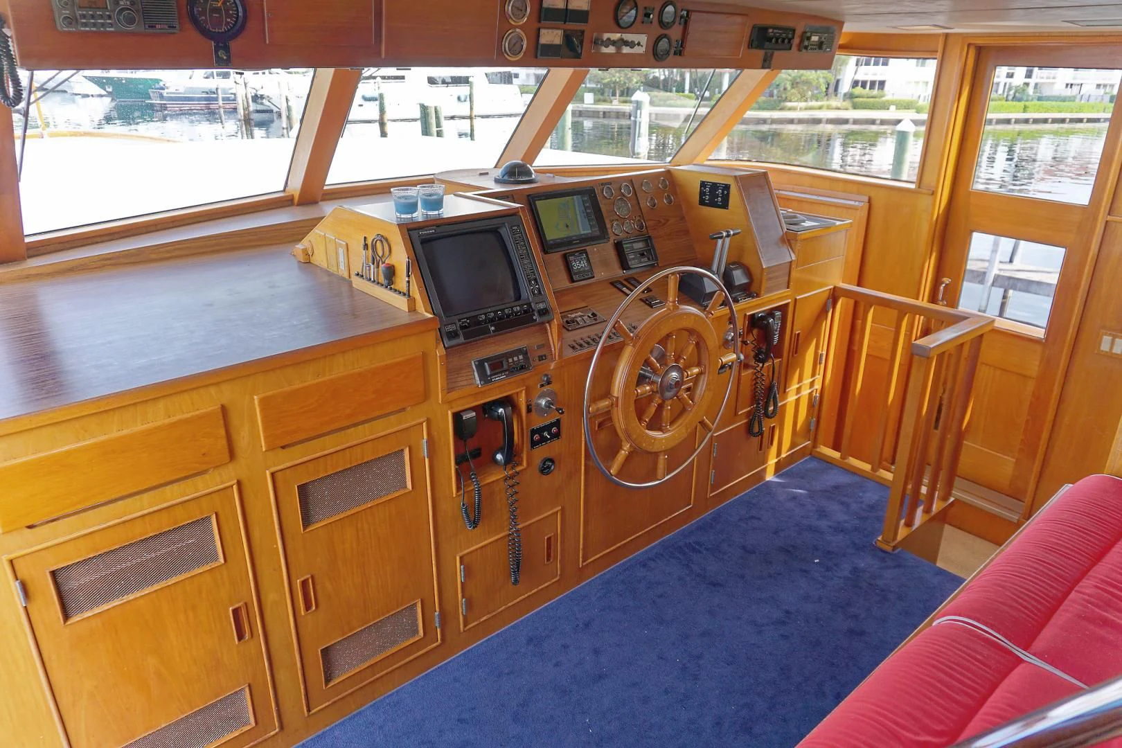 a room with a tv and a couch aboard ENCORE V Yacht for Sale