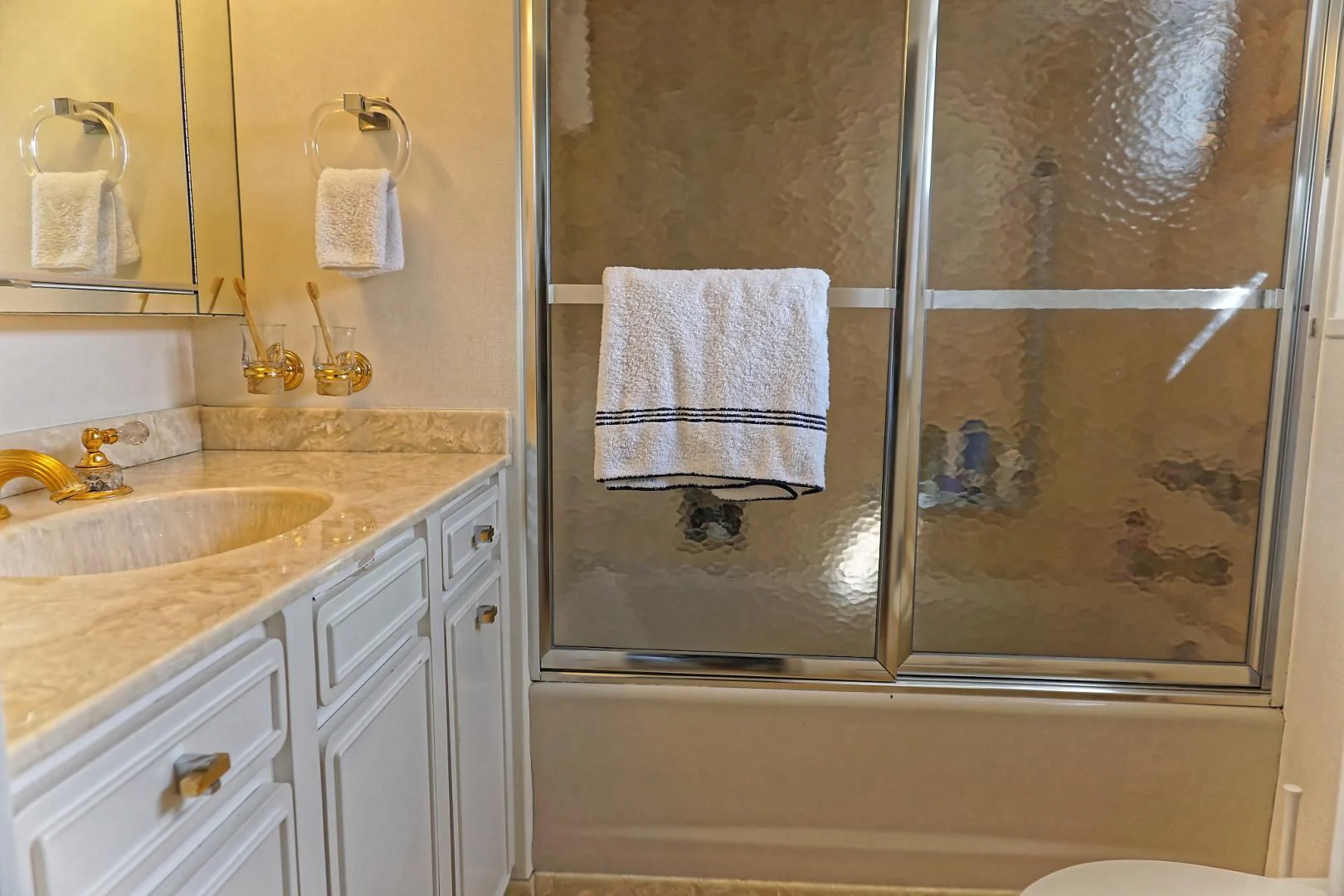a bathroom with a glass shower aboard ENCORE V Yacht for Sale