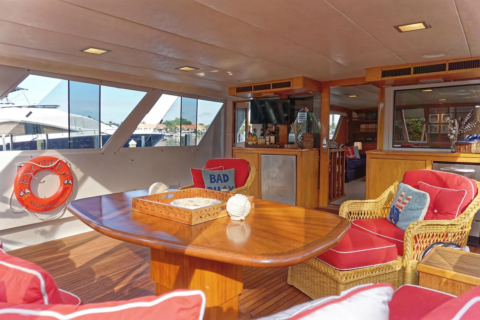 a table with a plate of food on it aboard ENCORE V Yacht for Sale