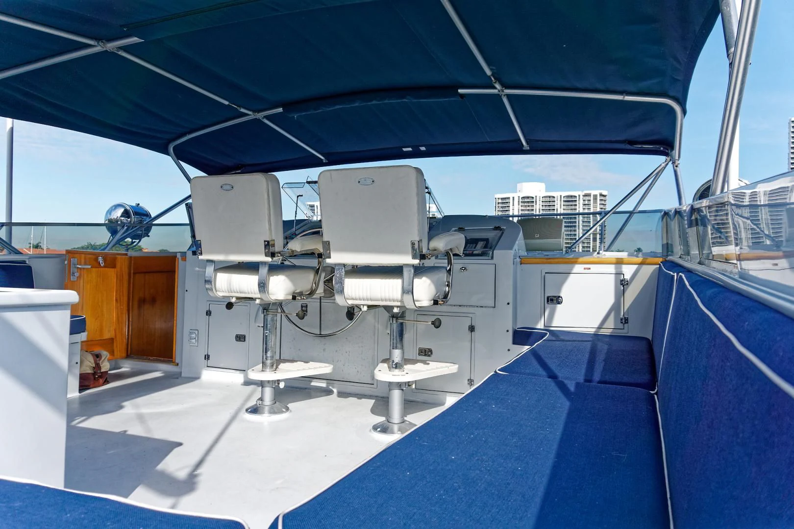 a boat with a deck and chairs aboard ENCORE V Yacht for Sale