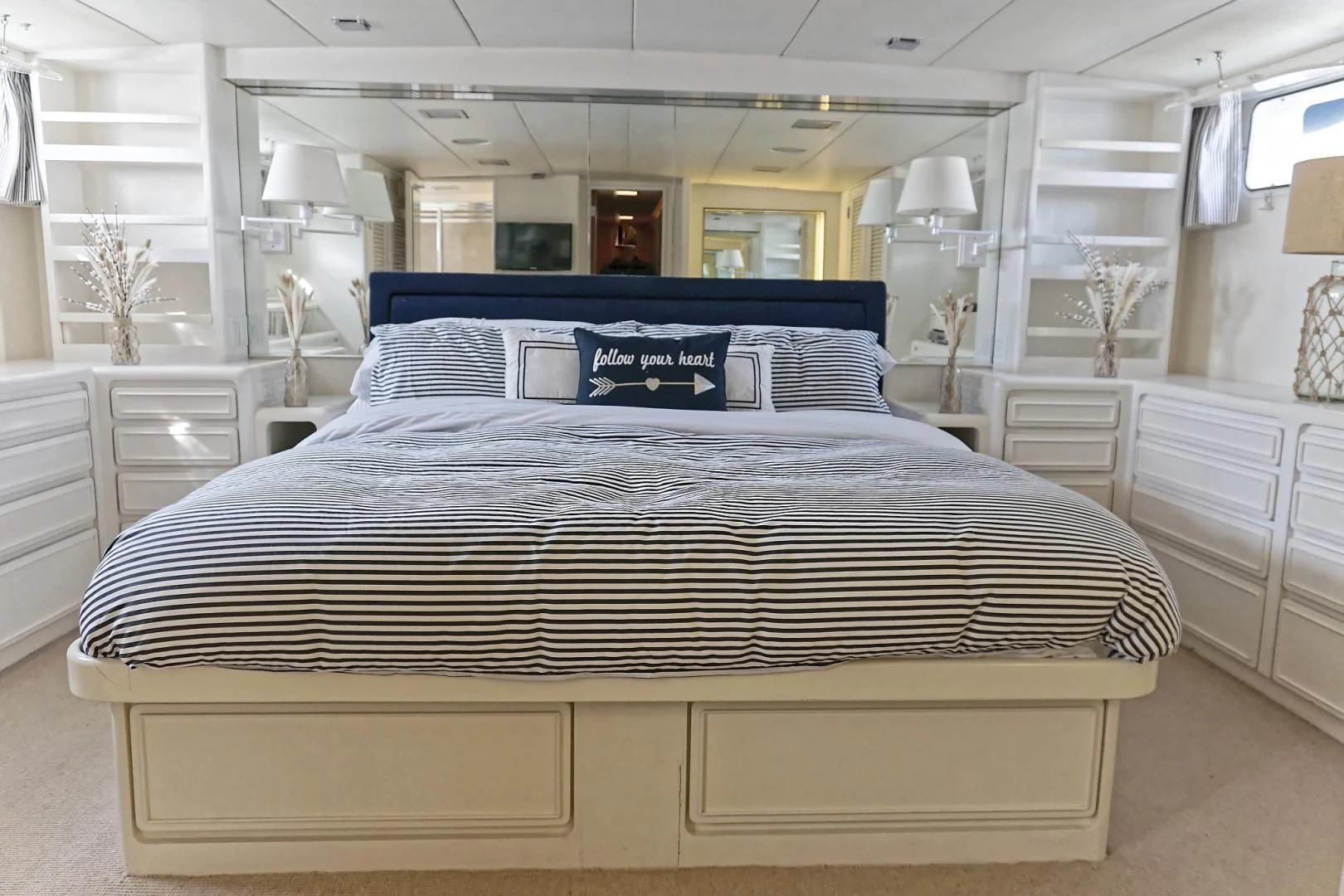 a bed in a room aboard ENCORE V Yacht for Sale