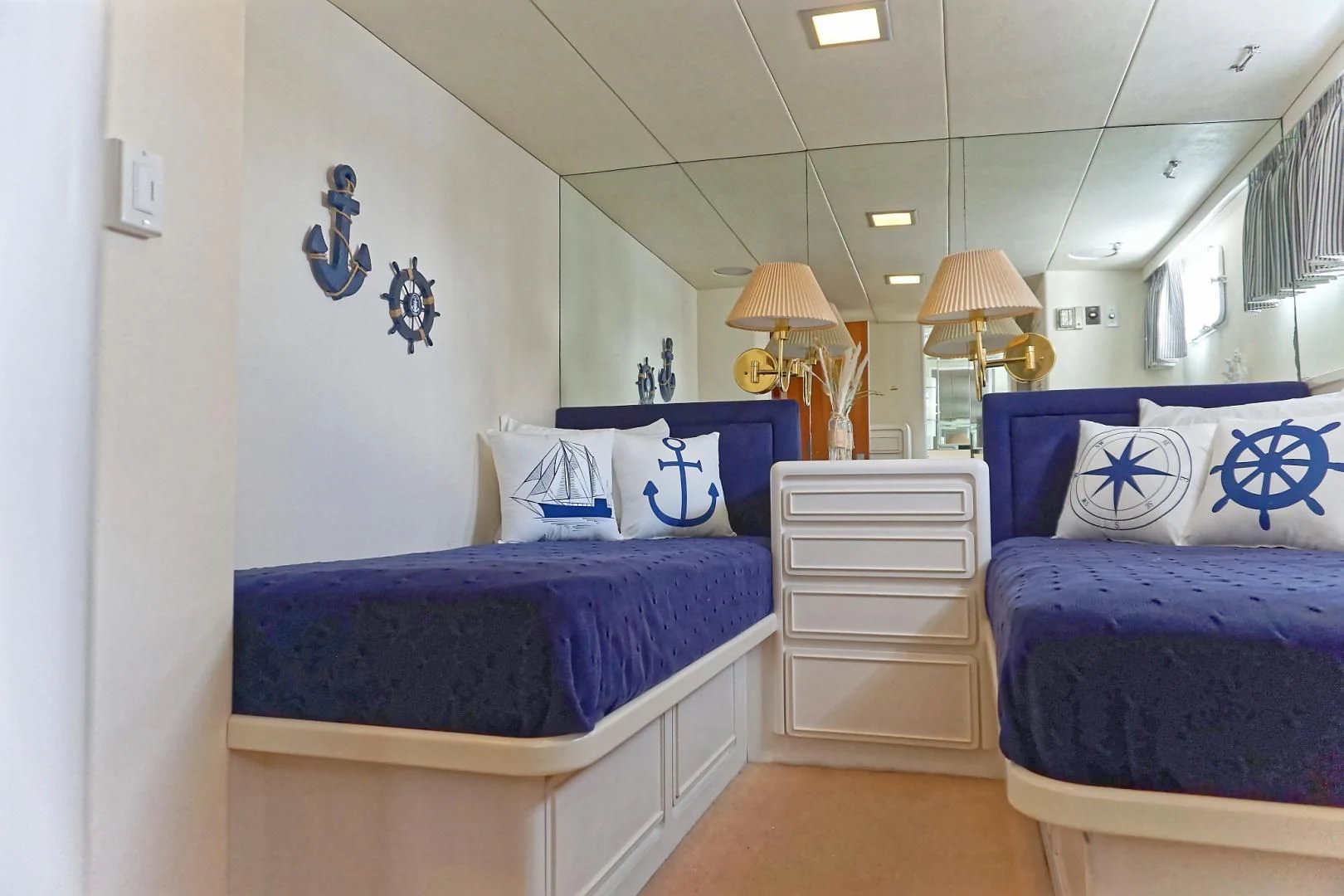 a couple of beds in a room aboard ENCORE V Yacht for Sale