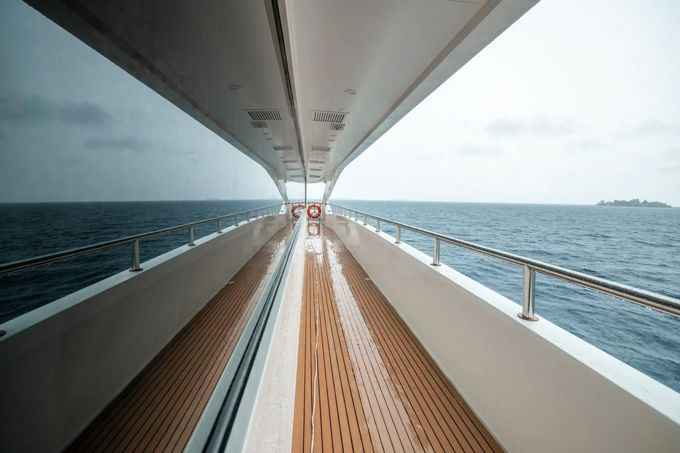 a long wooden dock over water aboard INFINITY X Yacht for Sale