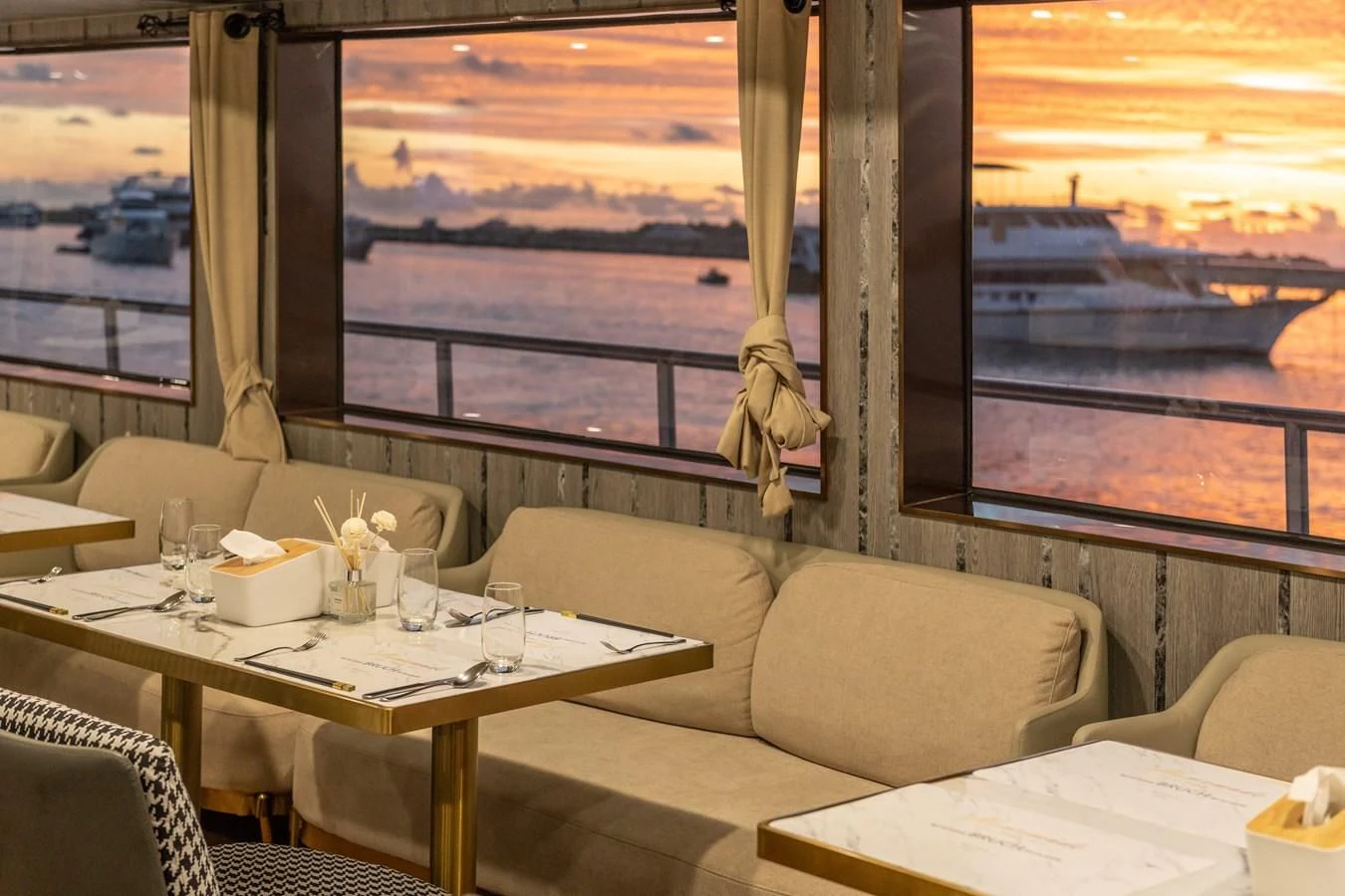 a room with a table and chairs aboard INFINITY X Yacht for Sale