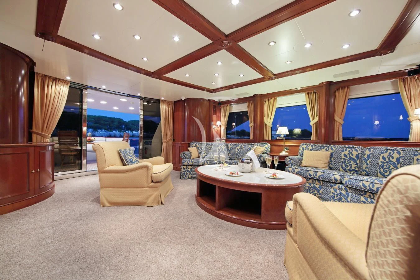 a living room with a large window aboard INOUIS Yacht for Charter
