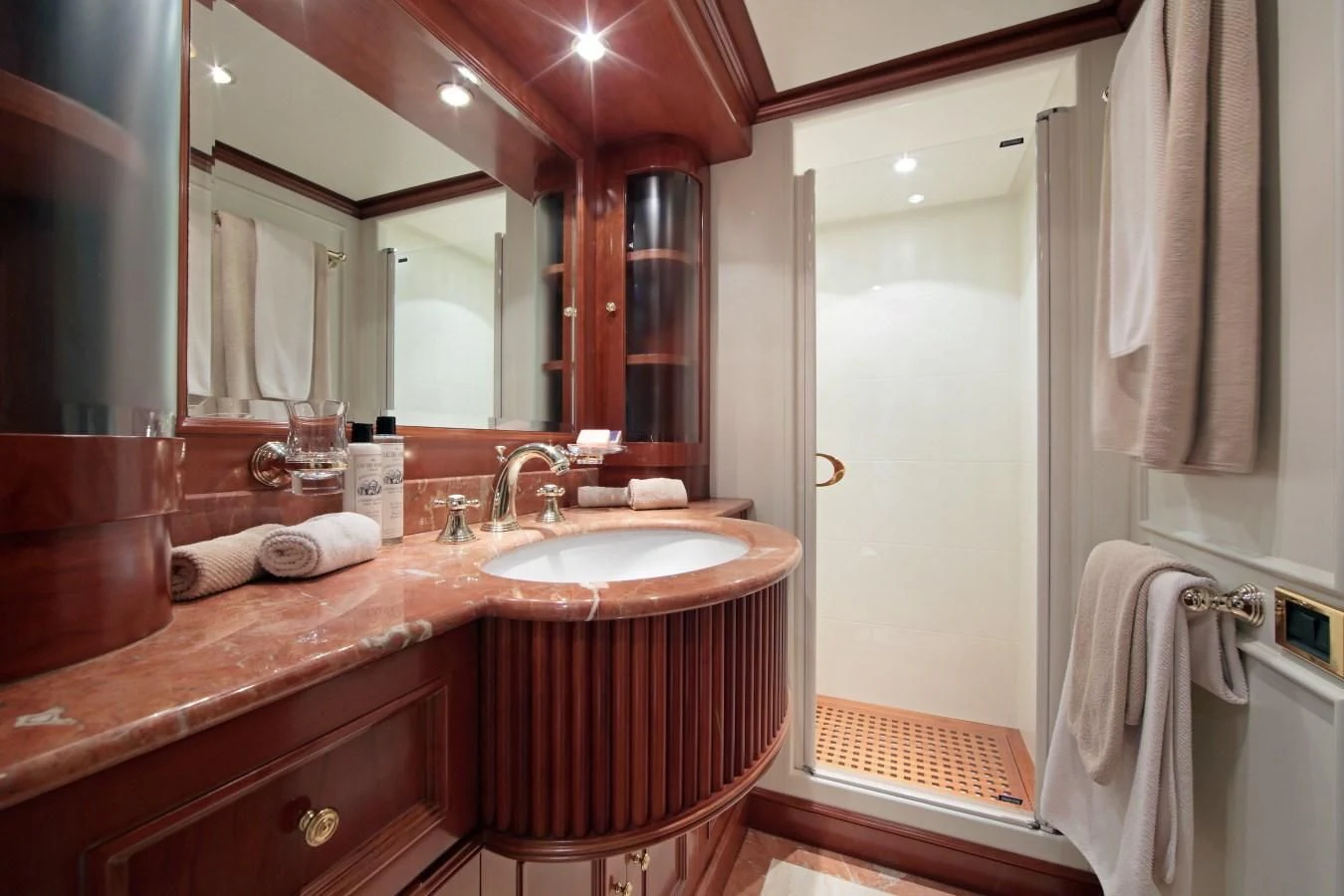 a bathroom with a large mirror aboard INOUIS Yacht for Charter