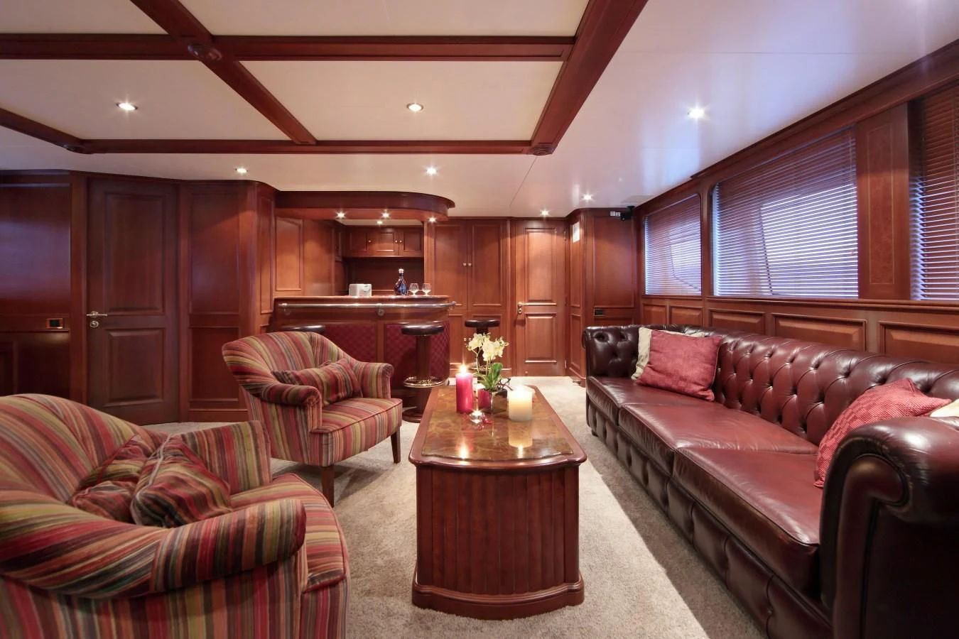 a living room with a couch and a coffee table aboard INOUIS Yacht for Charter
