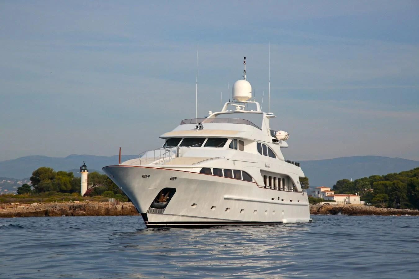 a white boat on water aboard INOUIS Yacht for Charter