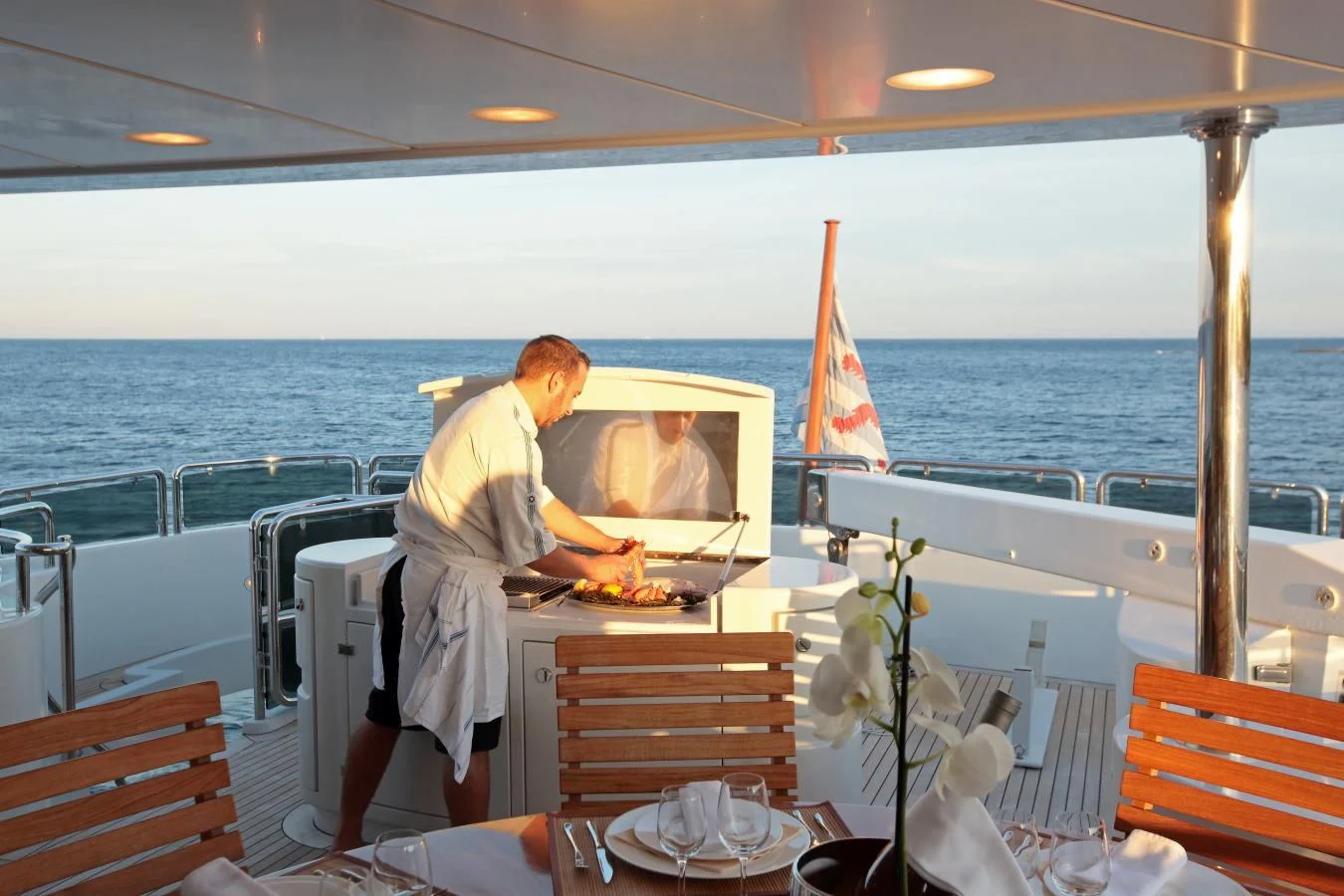 a person cooking on a boat aboard INOUIS Yacht for Charter