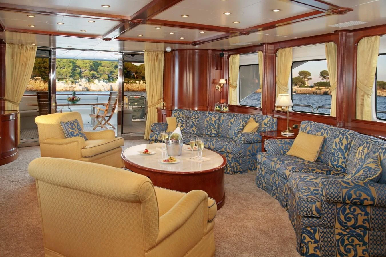a living room with a large window aboard INOUIS Yacht for Charter