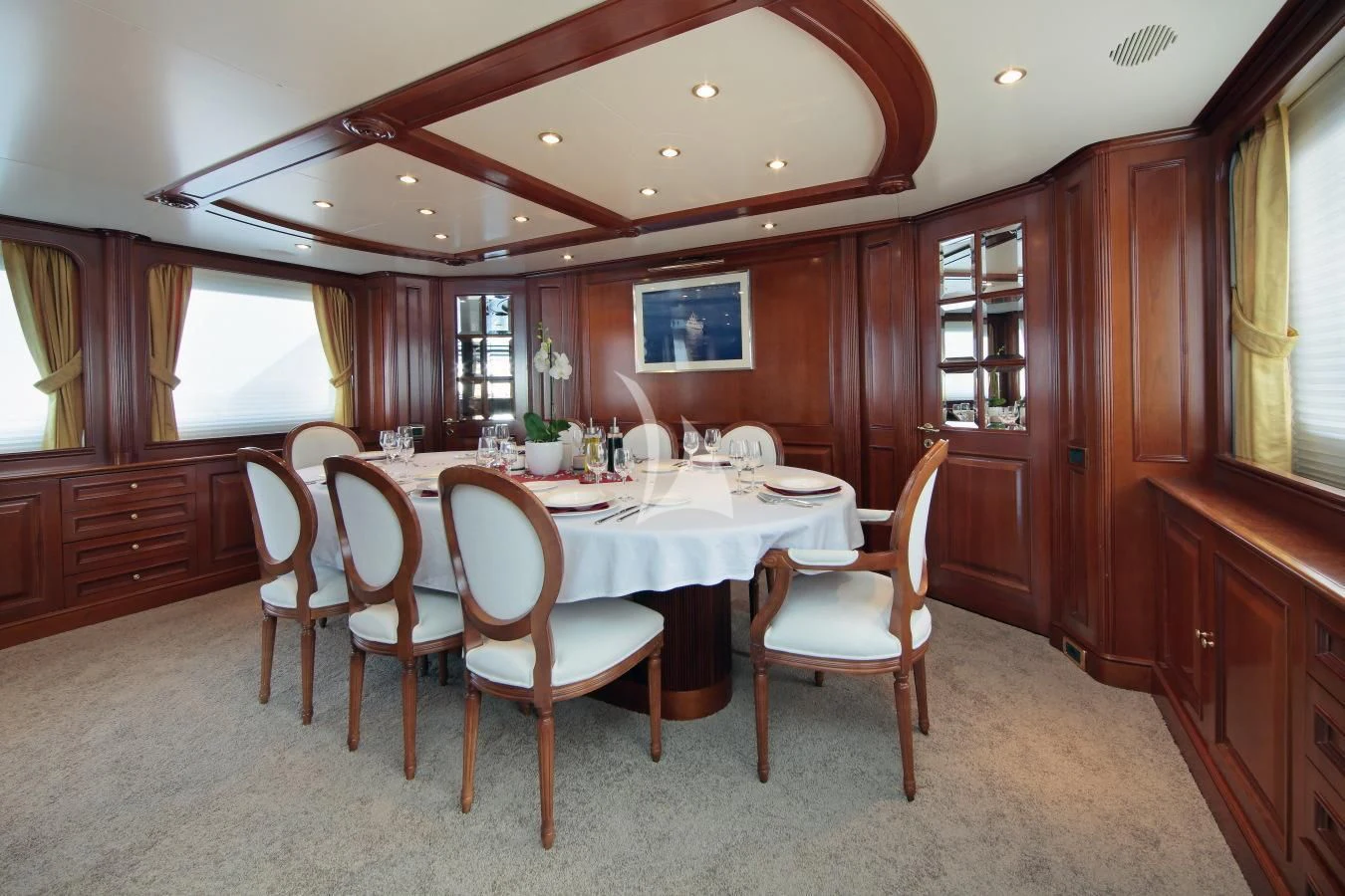 a dining room with a table and chairs aboard INOUIS Yacht for Charter