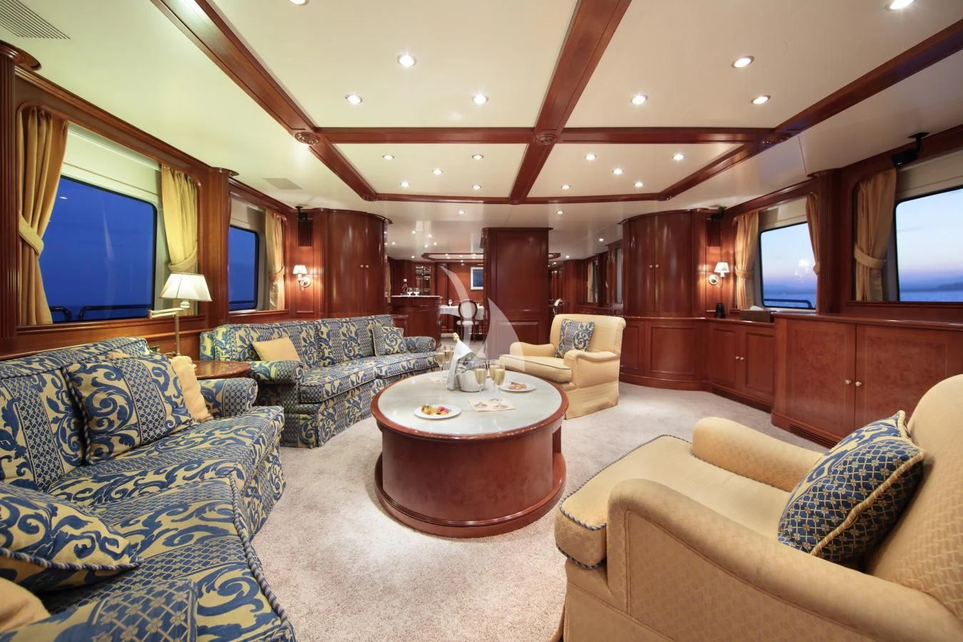 a living room with a large wood paneled ceiling aboard INOUIS Yacht for Charter