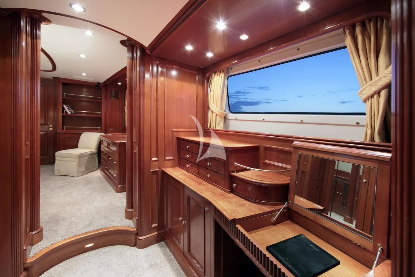 a room with a wood door and a large window aboard INOUIS Yacht for Charter