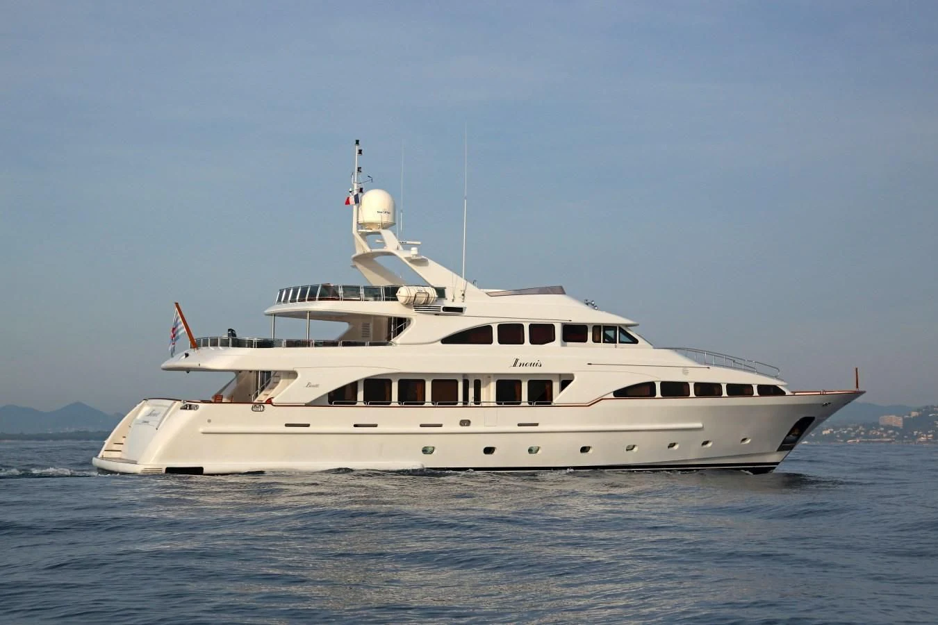 a large white boat in the water aboard INOUIS Yacht for Charter