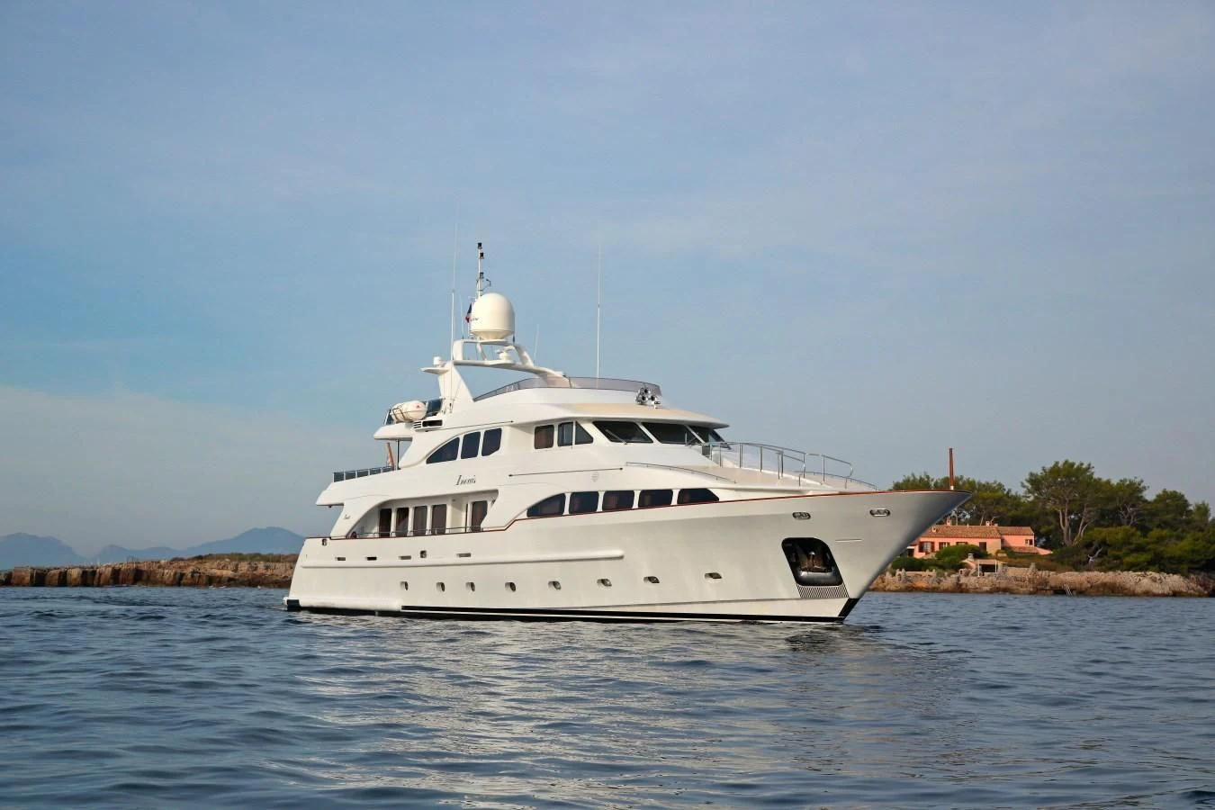 a white yacht on the water aboard INOUIS Yacht for Charter