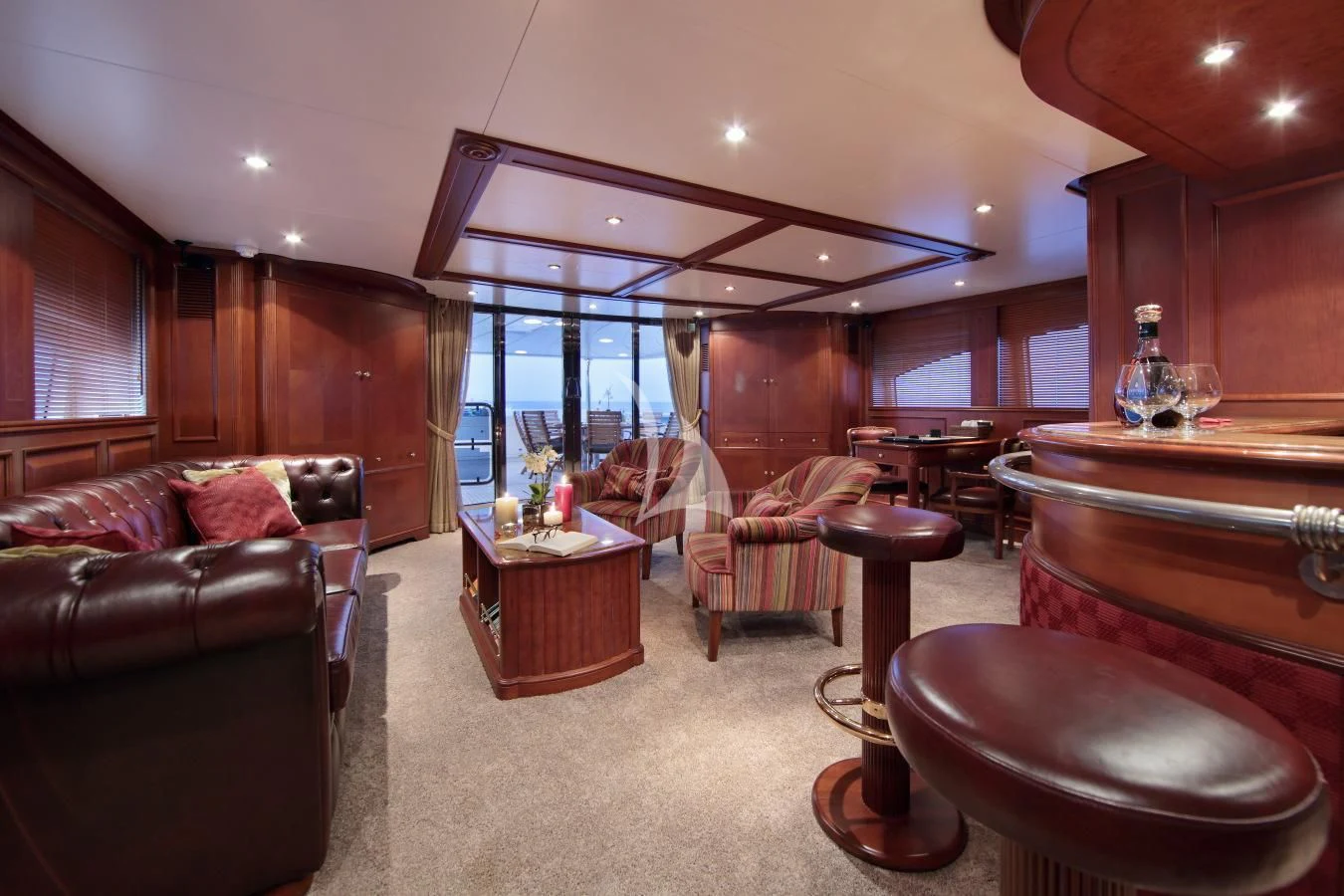 a living room with a large window aboard INOUIS Yacht for Charter