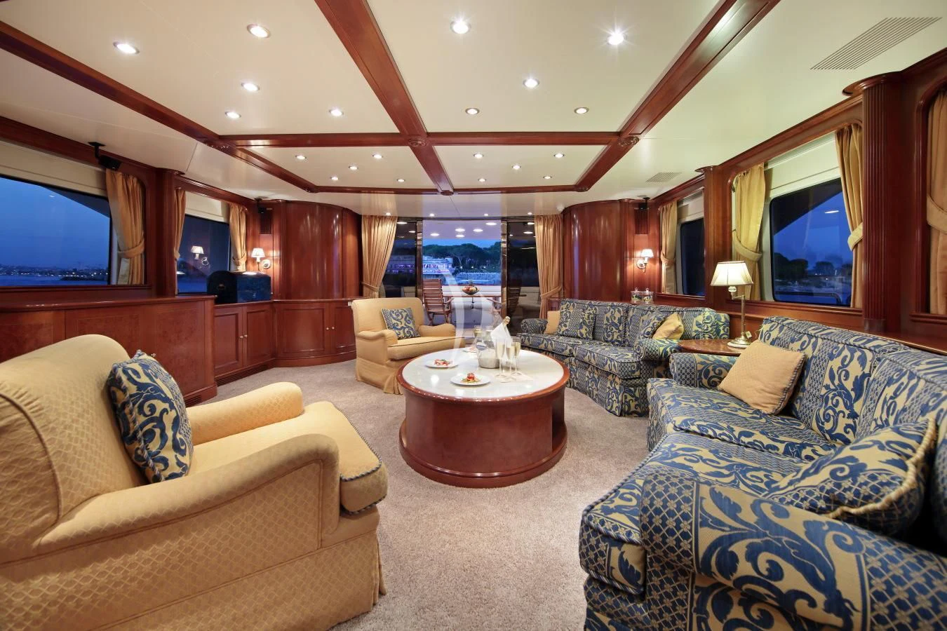 a living room with a large window aboard INOUIS Yacht for Charter
