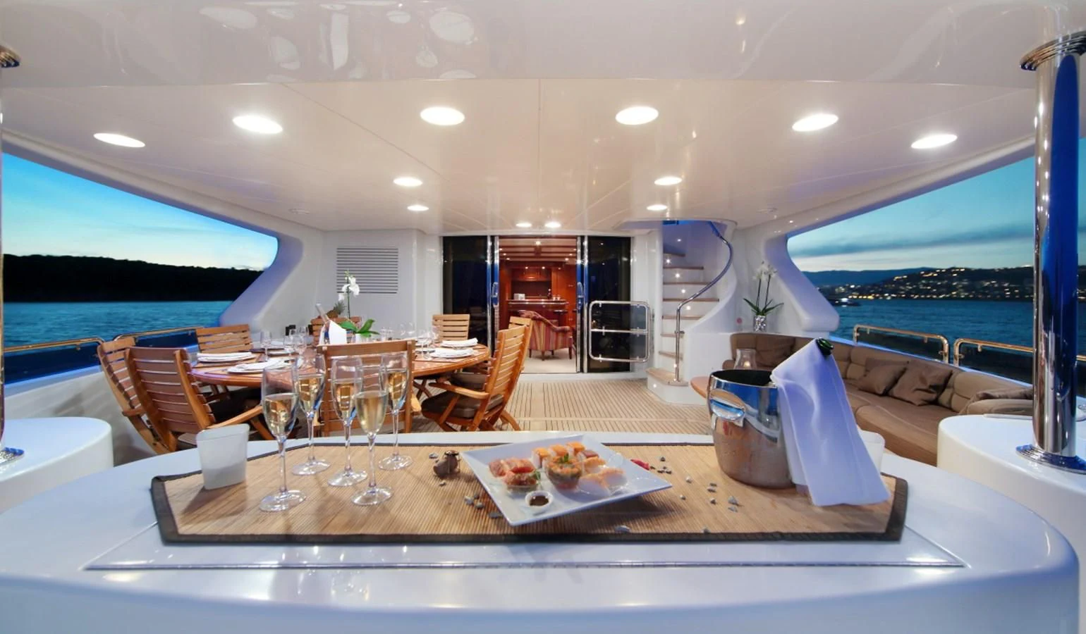 a large room with a table and chairs aboard INOUIS Yacht for Charter