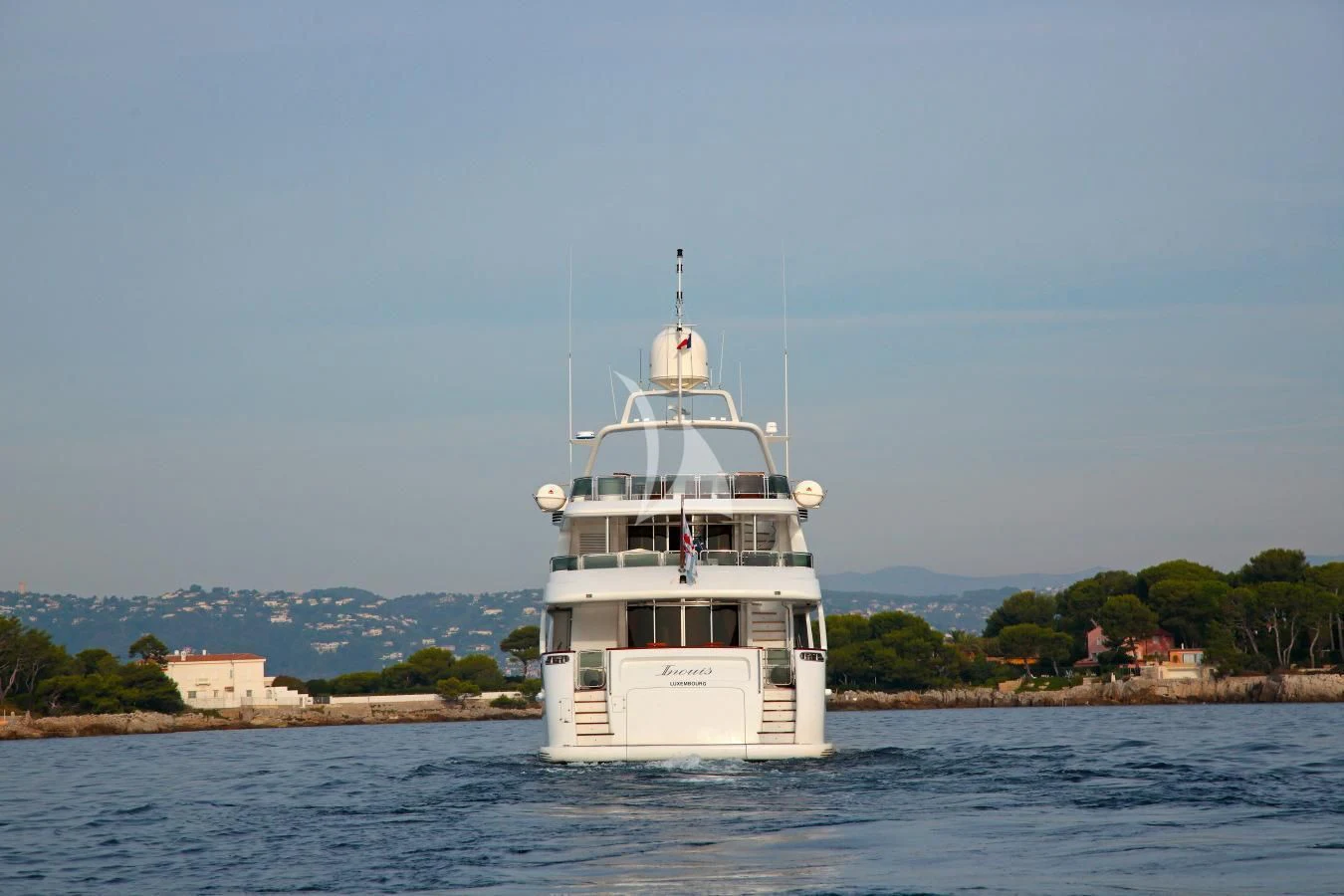 a white boat on water aboard INOUIS Yacht for Charter