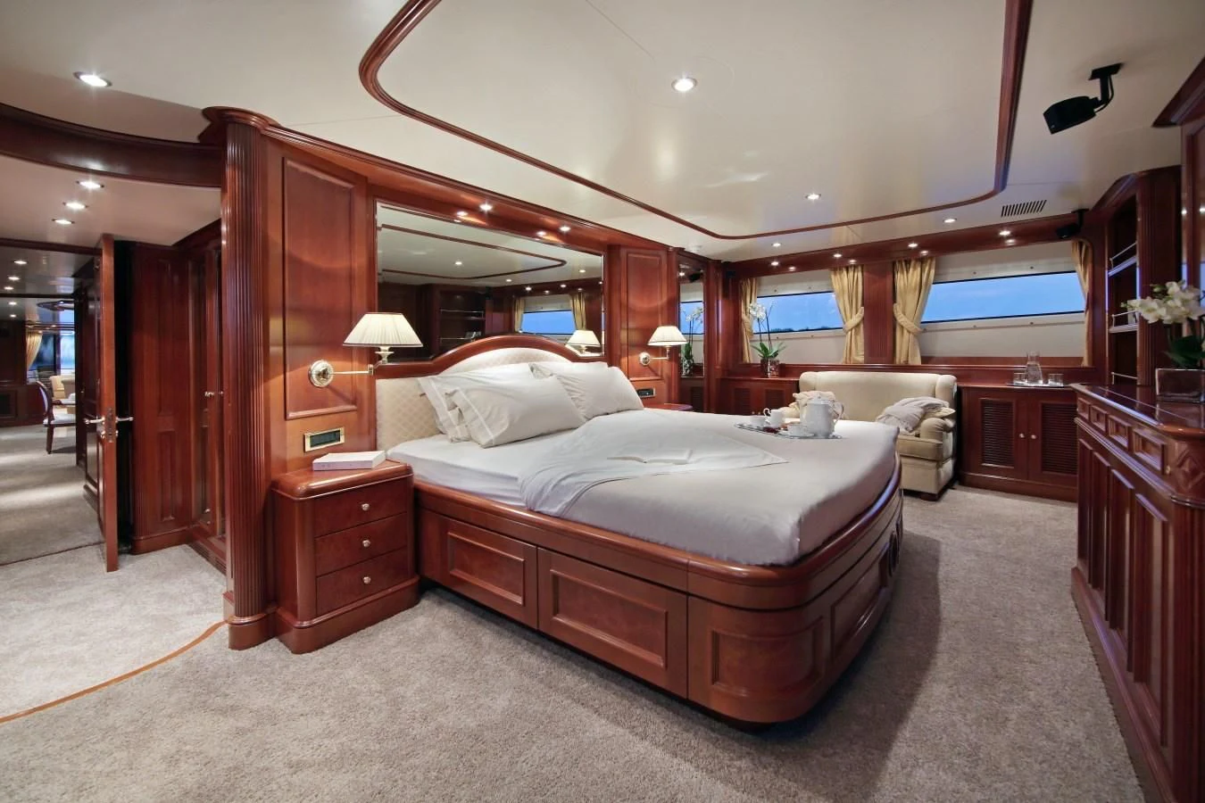 a bedroom with a bed and a desk aboard INOUIS Yacht for Charter
