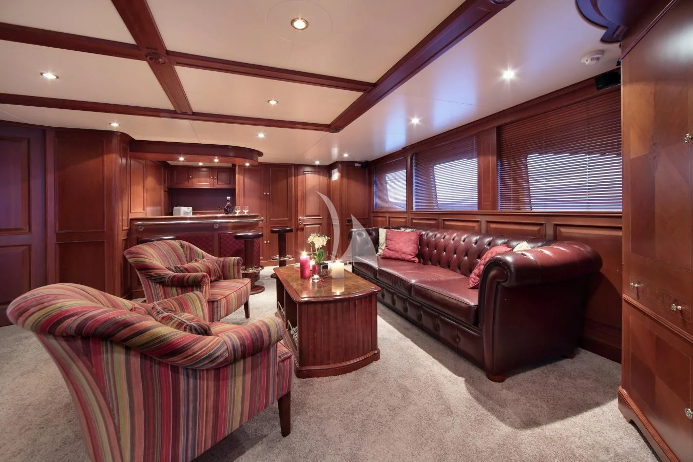 a living room with a couch and a table aboard INOUIS Yacht for Charter