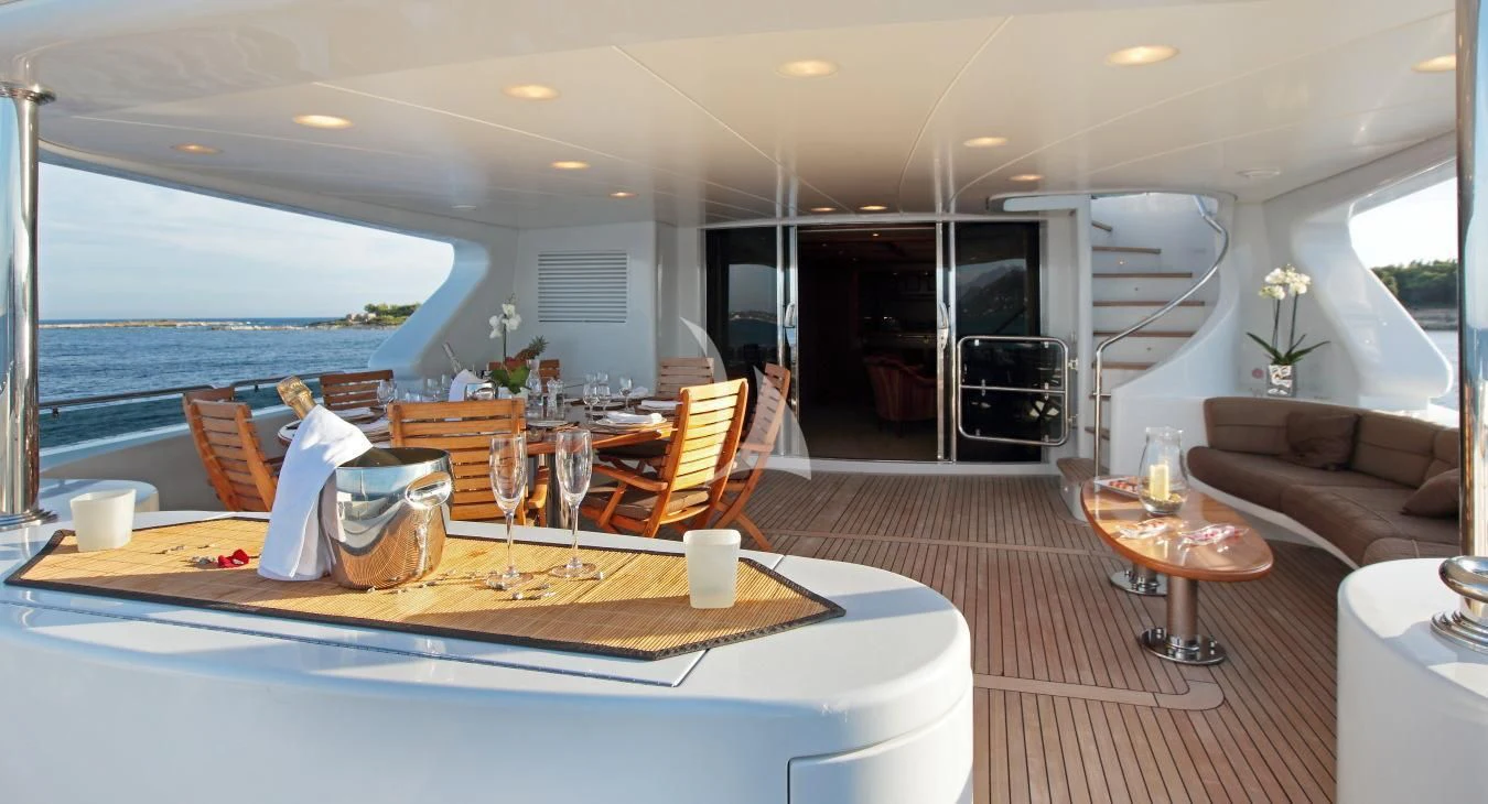 a dining room with a large table aboard INOUIS Yacht for Charter