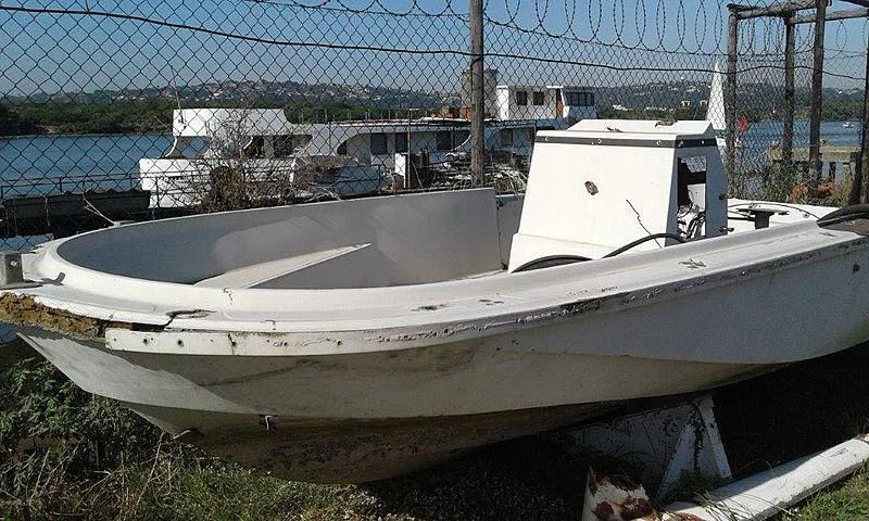 a boat in a yard aboard UTHINGO Yacht for Sale