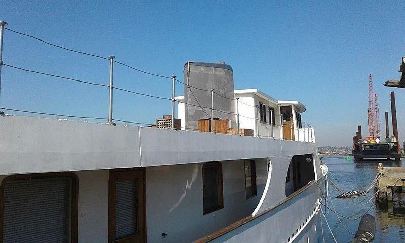 a building with a tower in the background aboard UTHINGO Yacht for Sale