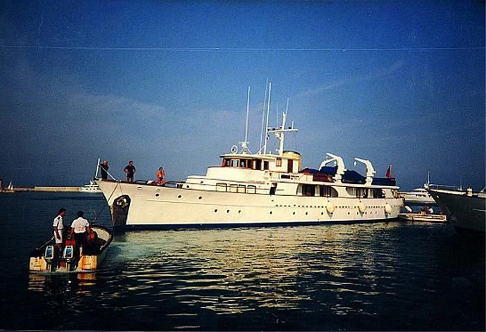 a large white boat with people on it aboard UTHINGO Yacht for Sale