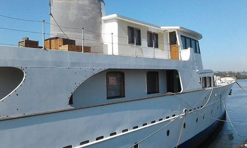 a large white boat aboard UTHINGO Yacht for Sale