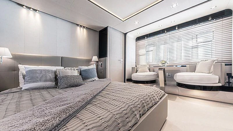a large bedroom with a large bed aboard TEMPTATION Yacht for Sale