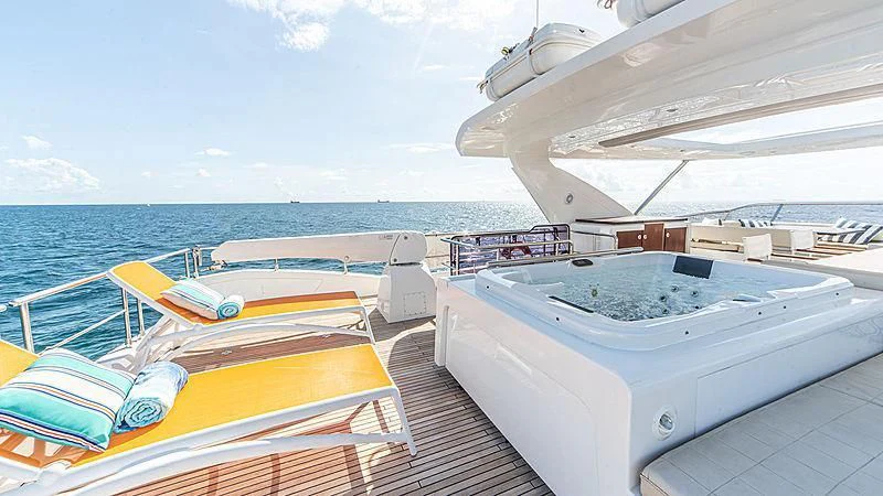 a boat docked at a pier aboard TEMPTATION Yacht for Sale