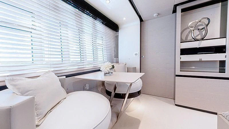a room with a bed and a desk aboard TEMPTATION Yacht for Sale