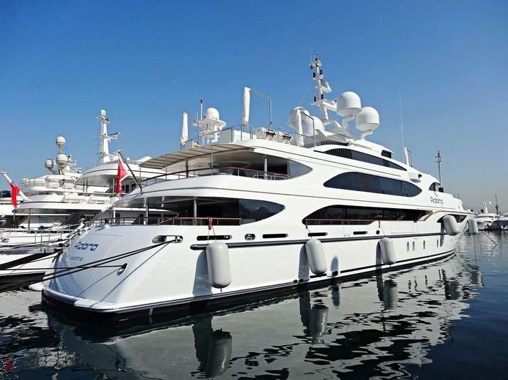 a white yacht in the water aboard ADORA Yacht for Sale