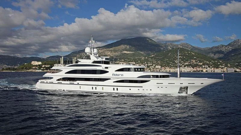 a white yacht on the water aboard ADORA Yacht for Sale
