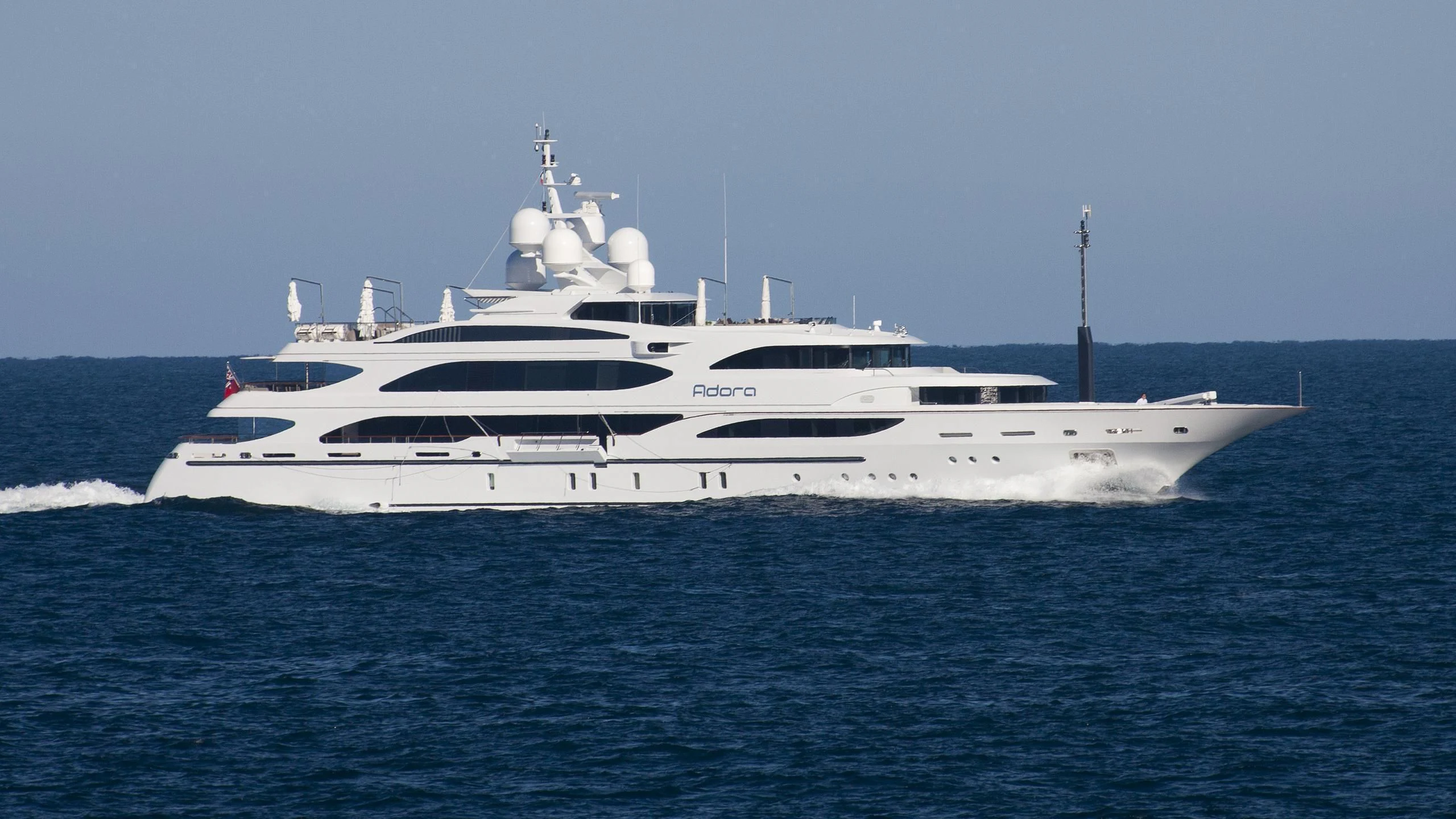 a white yacht in the water aboard ADORA Yacht for Sale